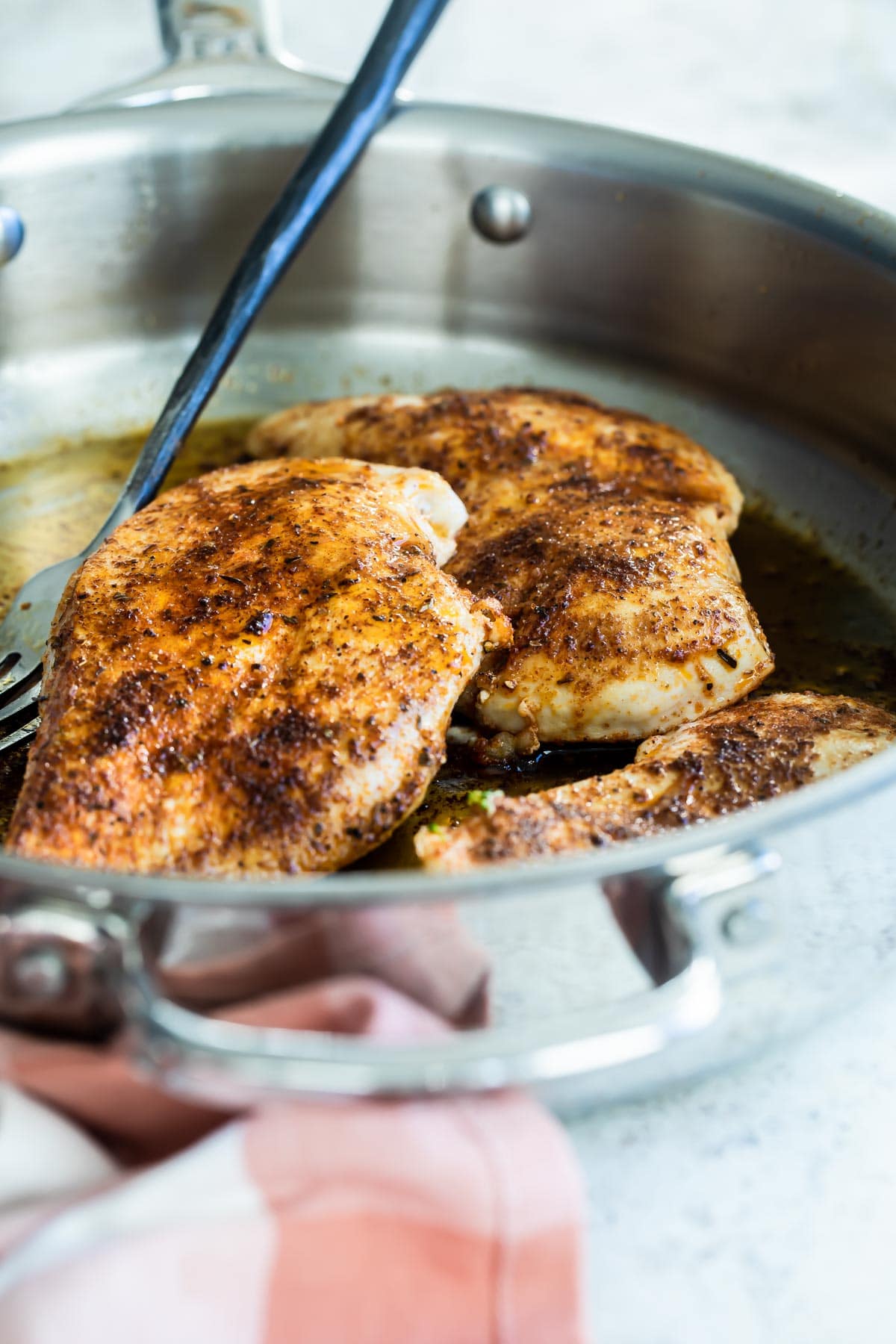 Cajun chicken in a skillet.