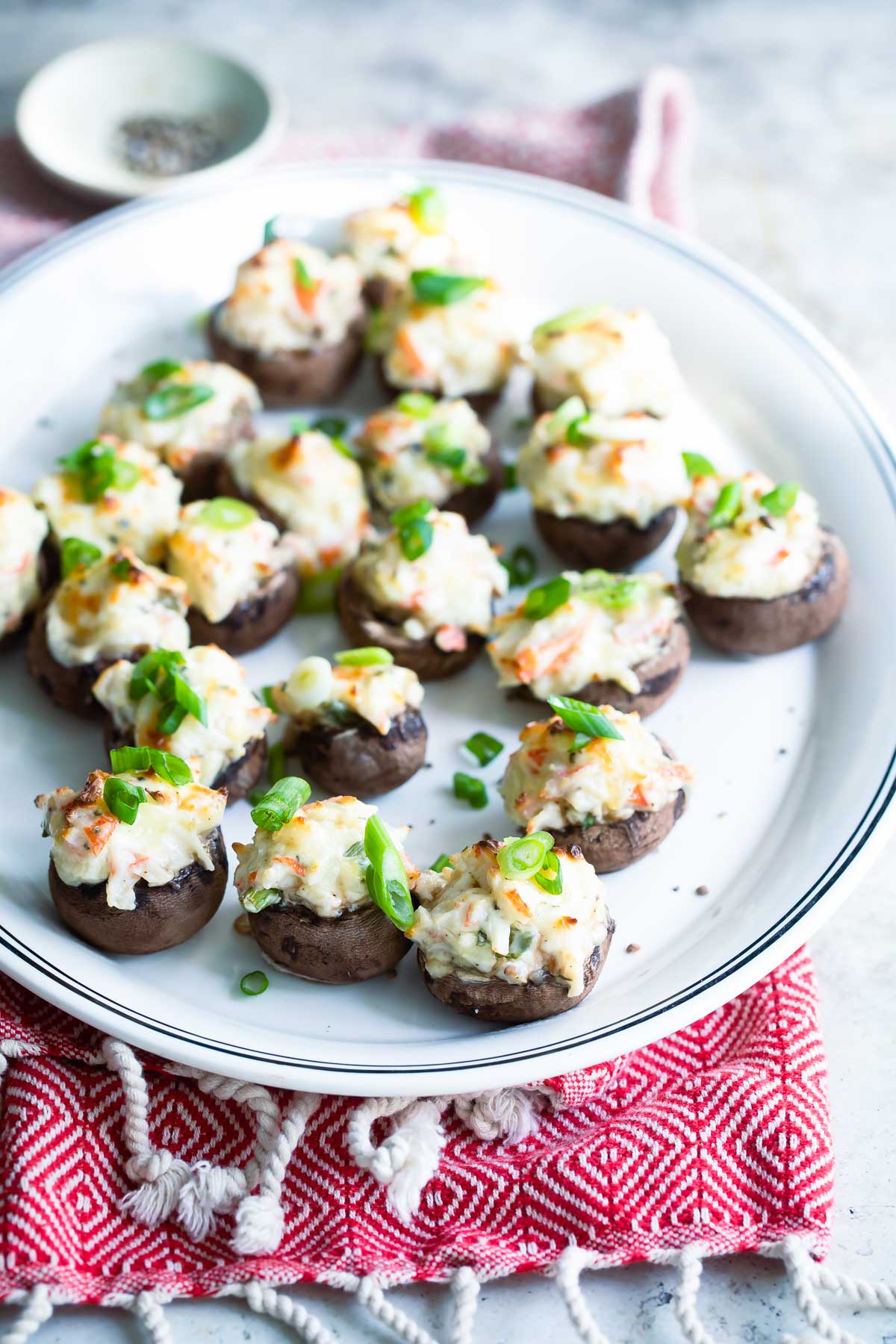 Crab stuffed mushrooms on an oval serving platter.