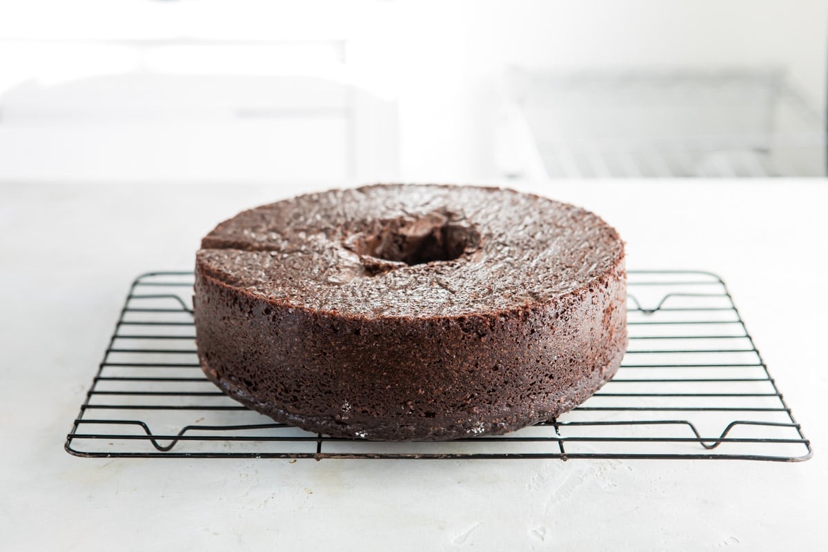 Chocolate cake on a cooling rack.
