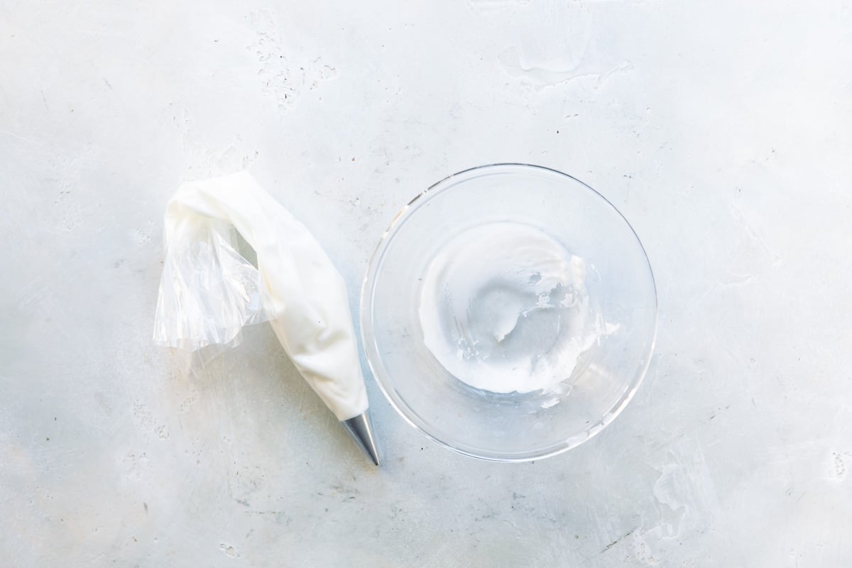 White frosting in a piping bag.