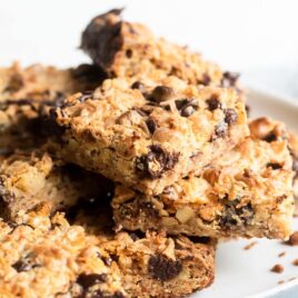 Seven layer bars on a gray plate.