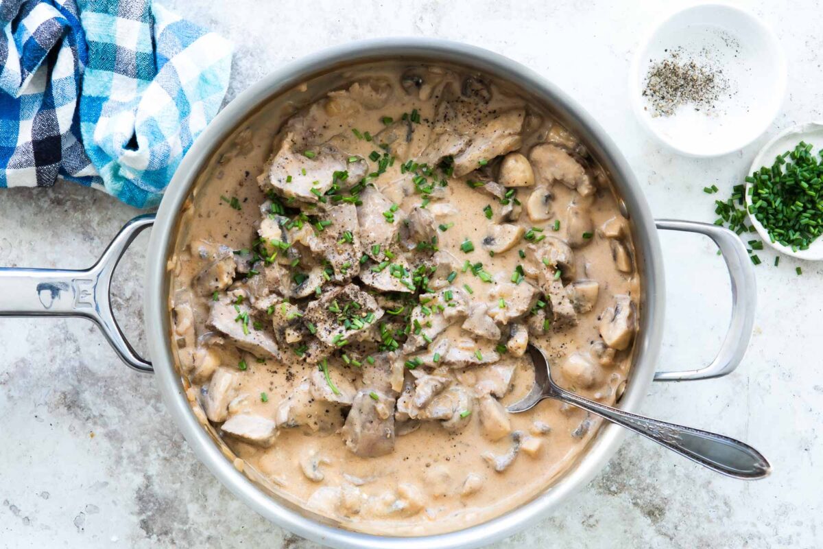 Beef stroganoff in a silver skillet.