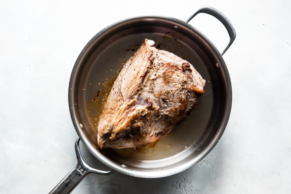 Browning a beef roast to make Chipotle barbacoa beef.