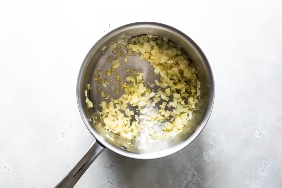 Cooking rice in a saucepan for pinto beans.