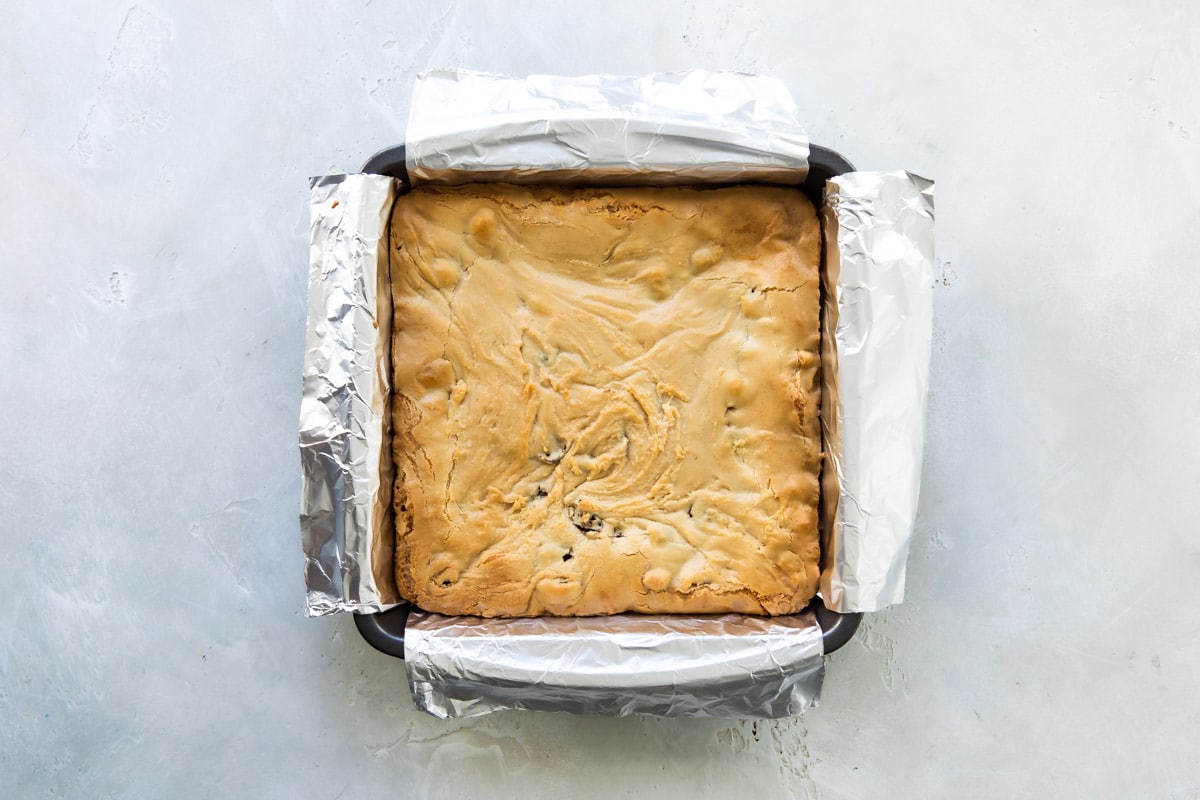 Cranberry bliss bars in a pan after being baked.