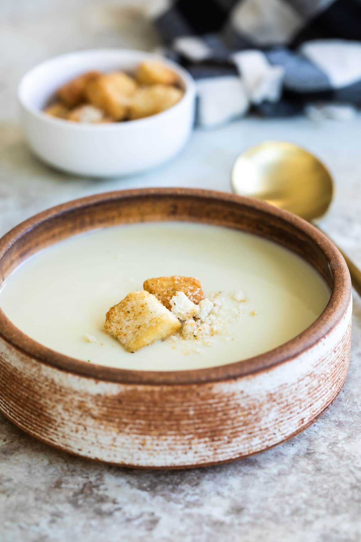 A bowl of Cream of Cauliflower Soup.