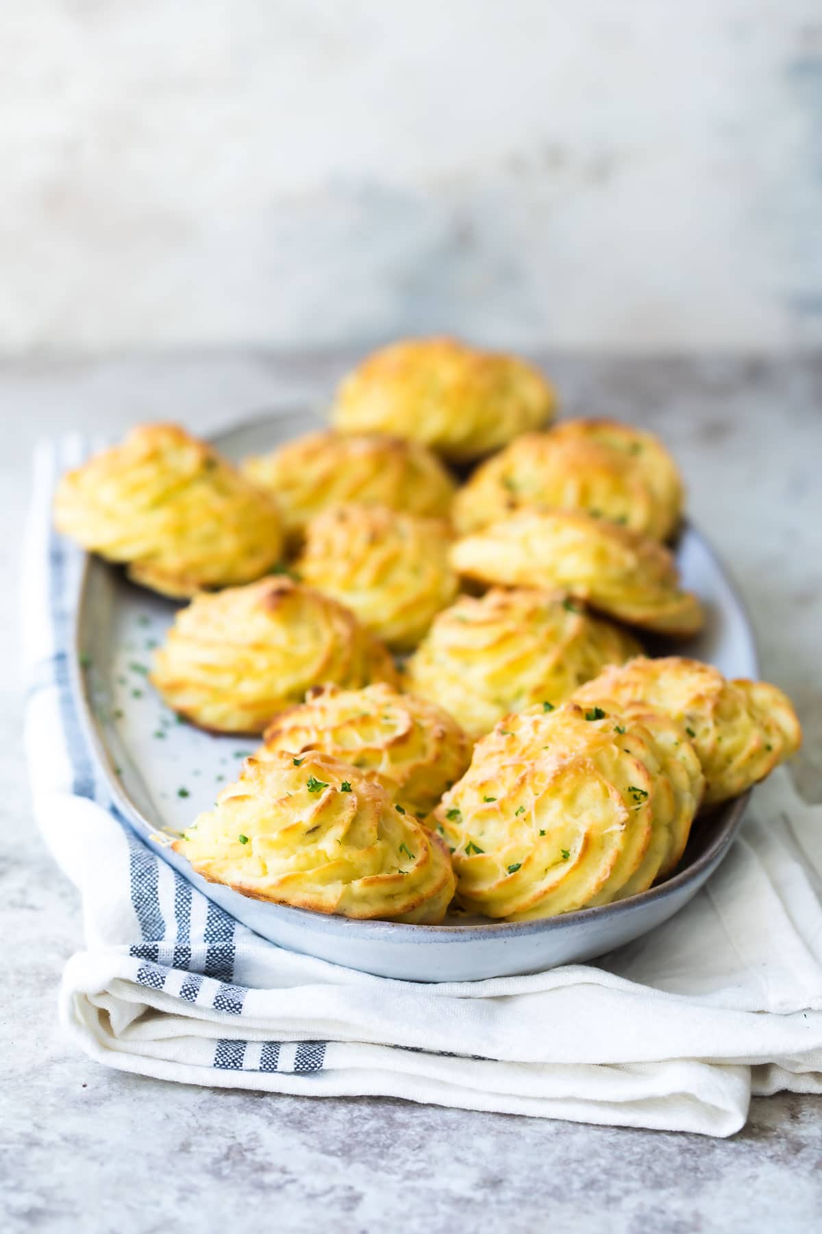 A platter of fluffy Duchess potatoes.