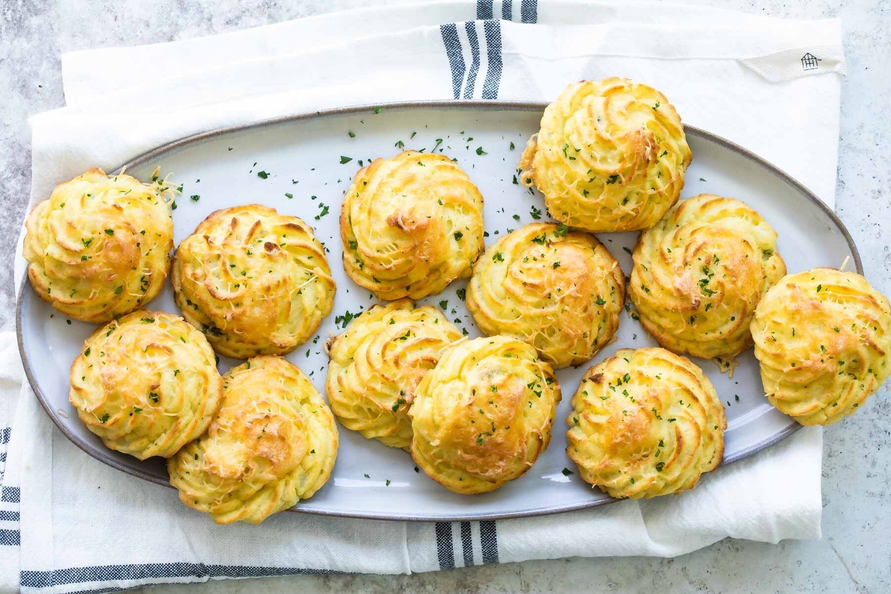 A platter of fluffy Duchess potatoes.
