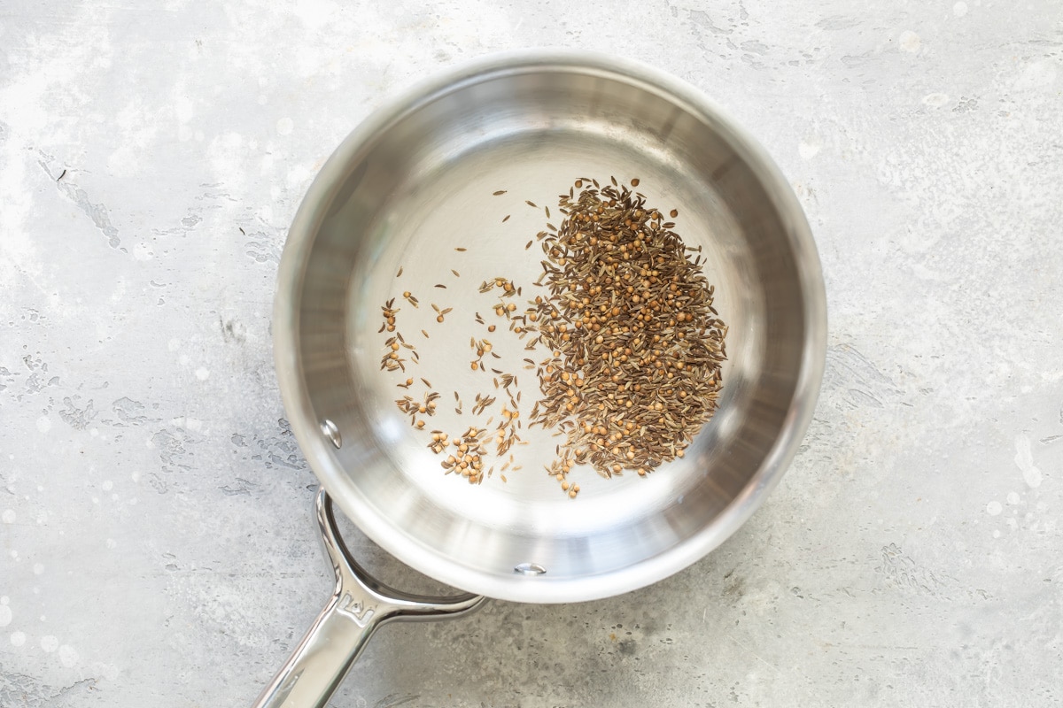 Caraway seeds in a sliver pot.
