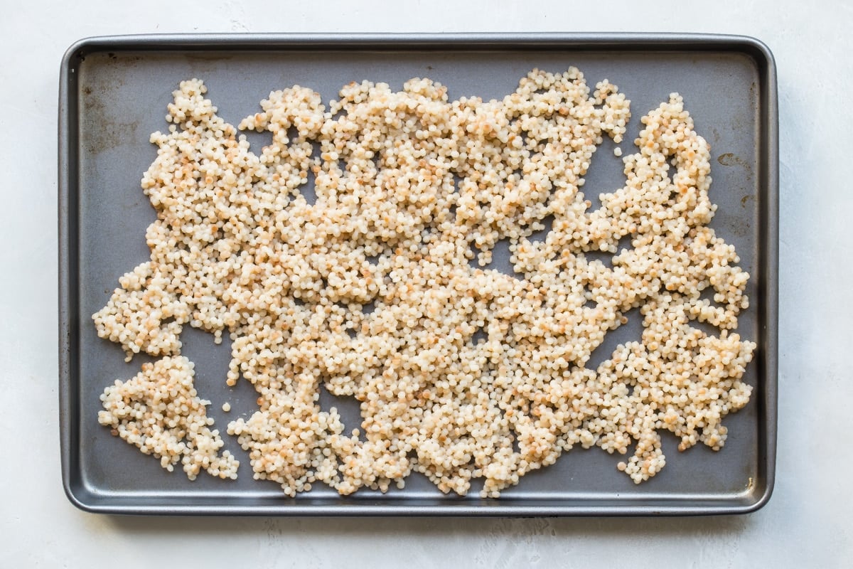 Couscous on a baking sheet.