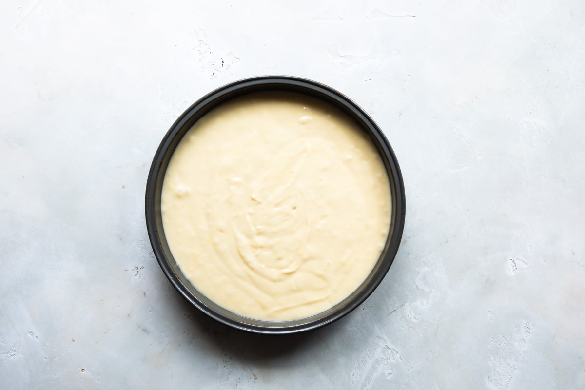 Lemon cake batter in a cake pan.