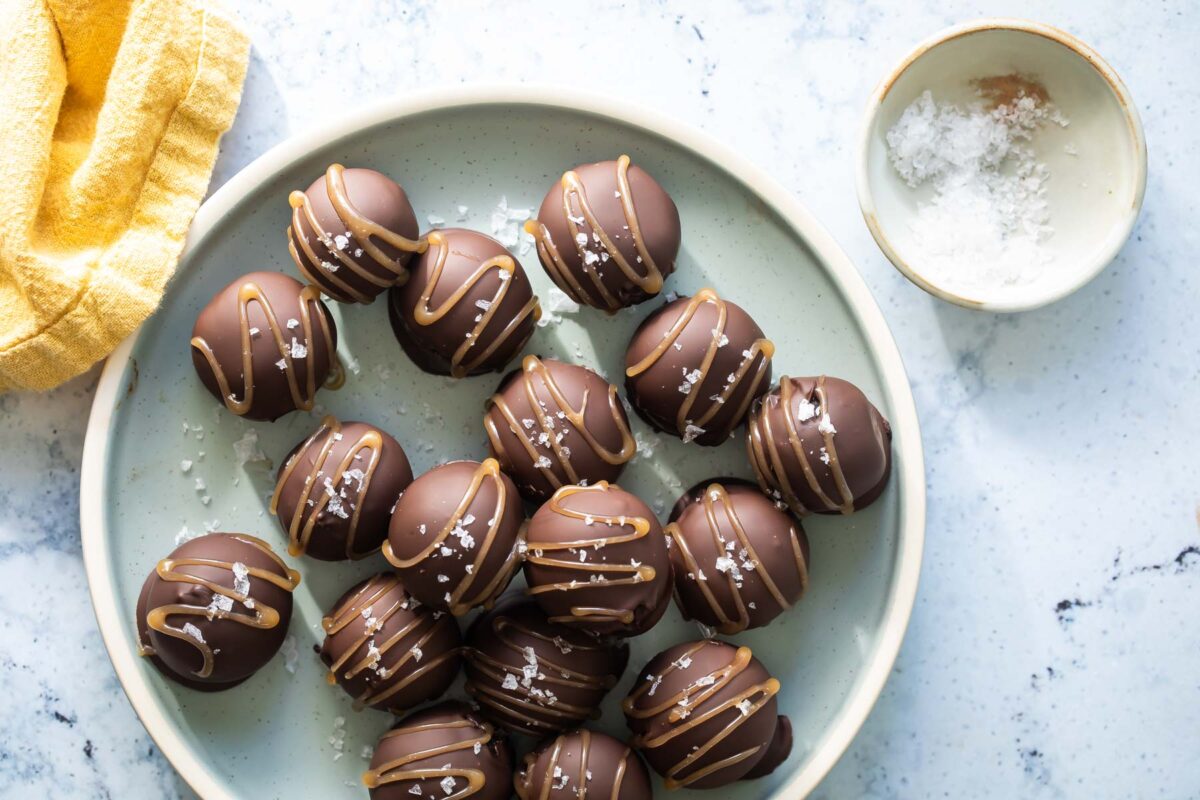Oreo cookie balls on a gray plate.