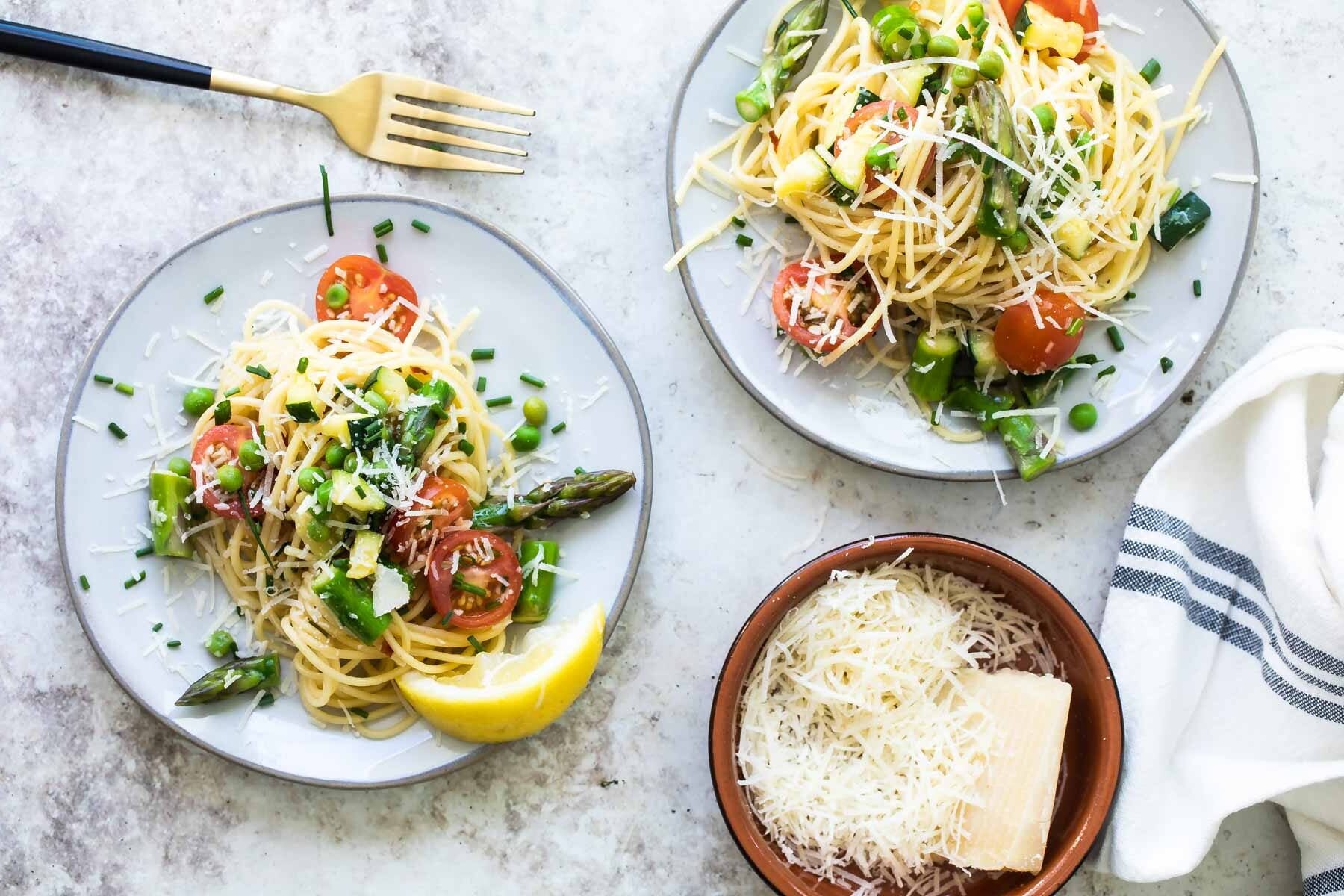 Two plates of Pasta Primavera.