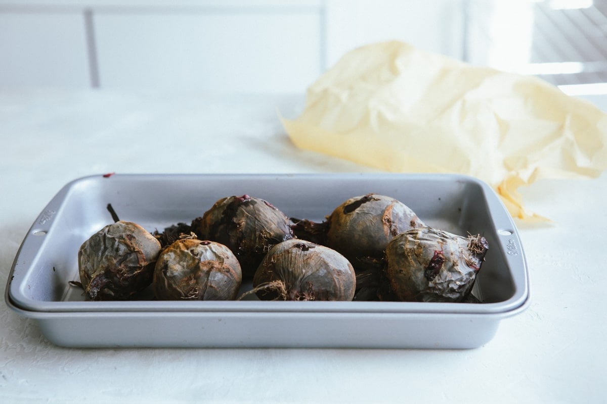Beets in a roasting pan.