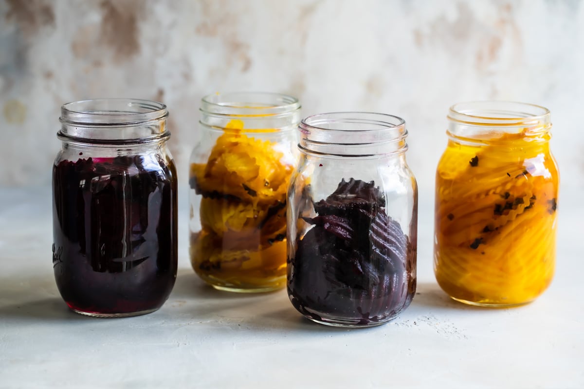 Four jars of pickled beets.