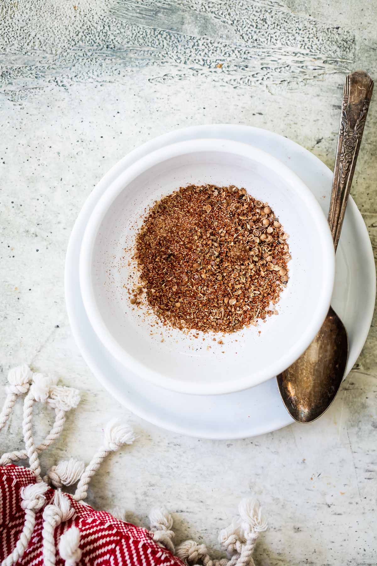 Pork spice blend in a white bowl.