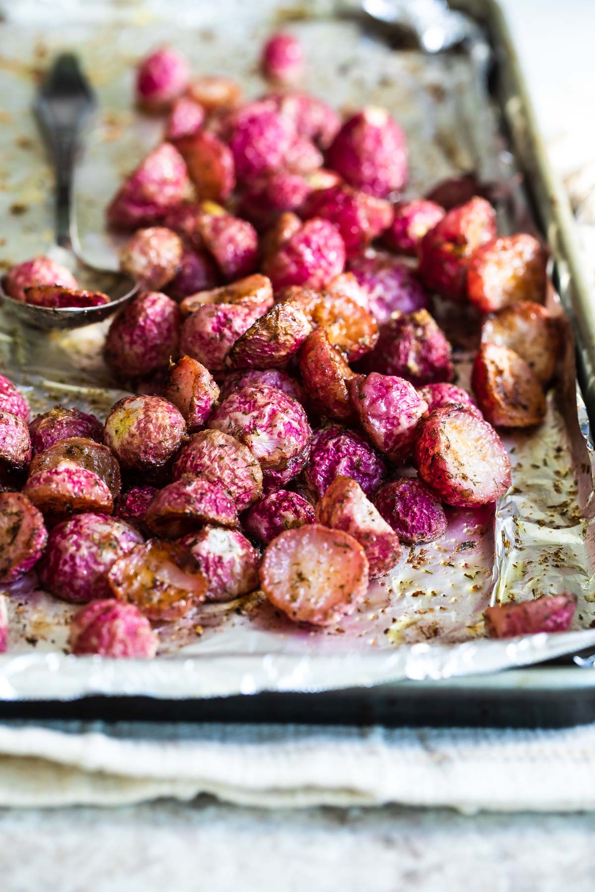 Roasted radishes on a baking sheet.