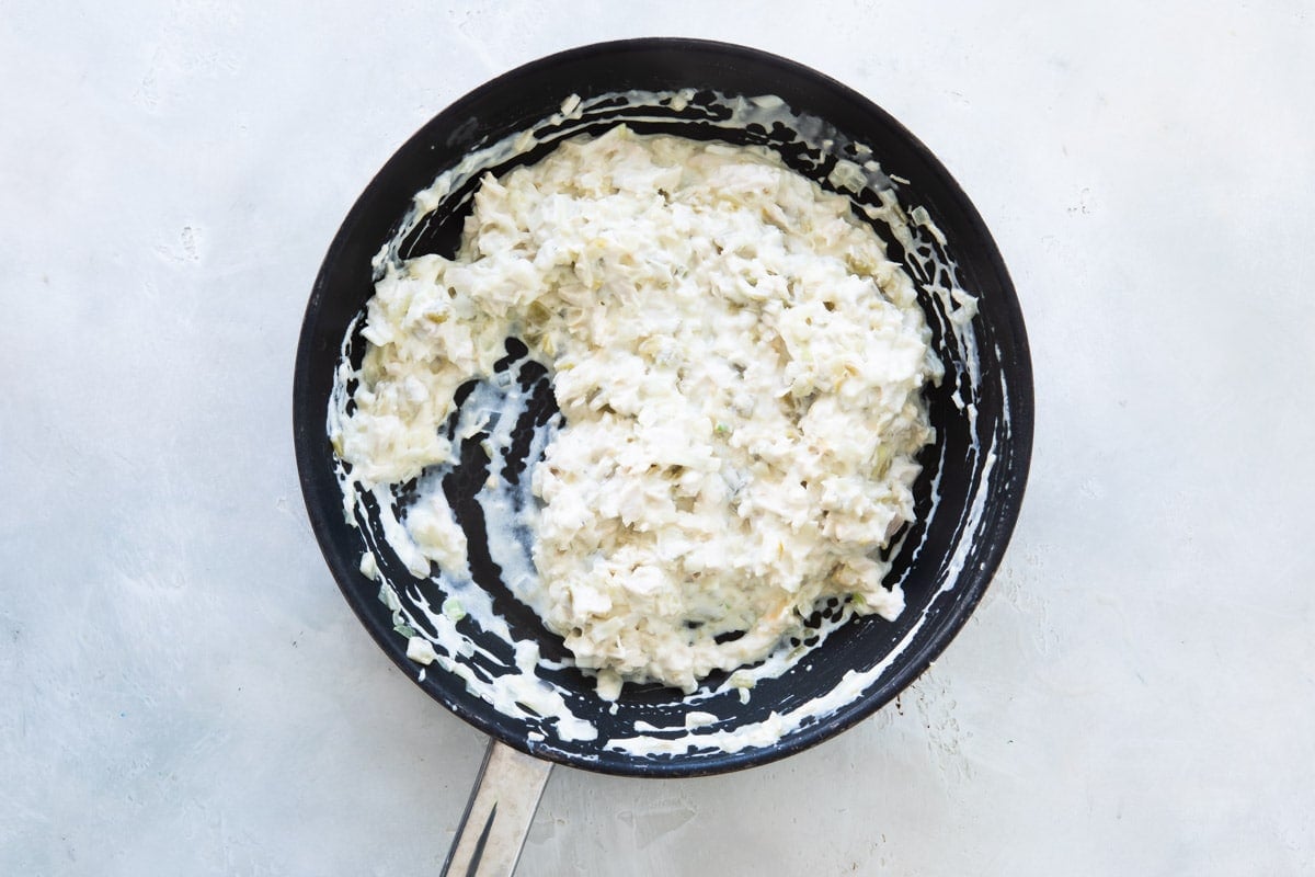 Sour cream and chicken mixture in a skillet.
