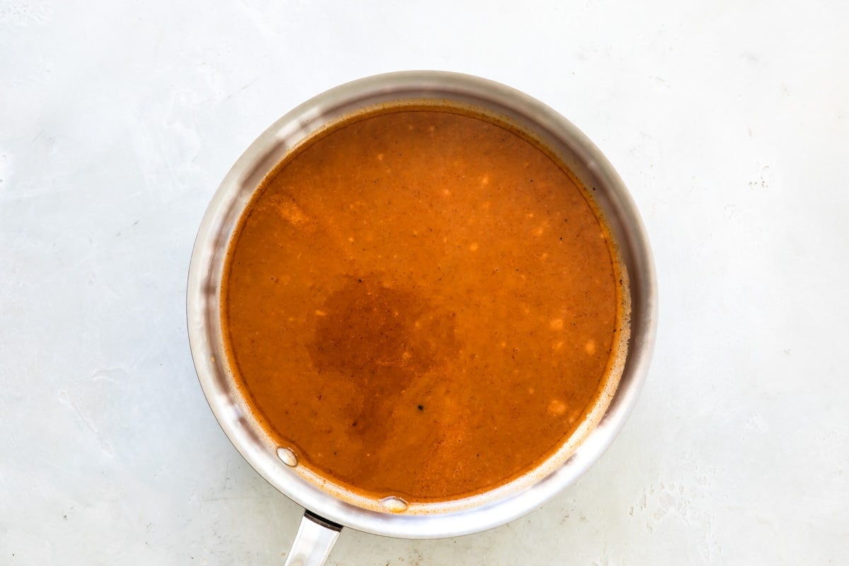 Enchilada sauce in a saucepan.