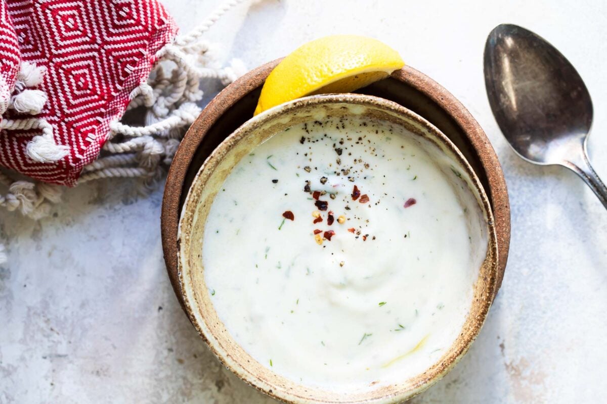 Yogurt sauce in a brown dish.