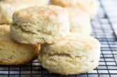 Buttermilk biscuits on a baking rack.
