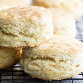 Buttermilk biscuits on a baking rack.
