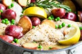 Chicken vesuvio in a silver skillet.