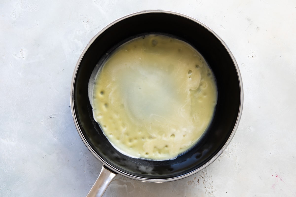Cooking crepes in a pan.