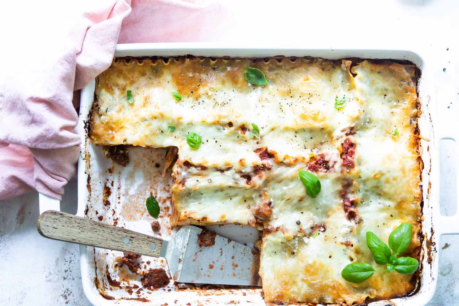 A white baking dish of lasagna.