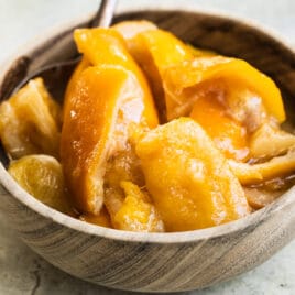 Preserved lemons in a wooden bowl.