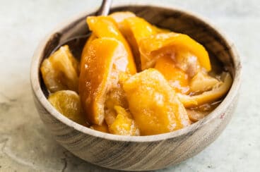 Preserved lemons in a wooden bowl.