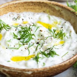 Tzatziki Sauce in a small brown bowl.