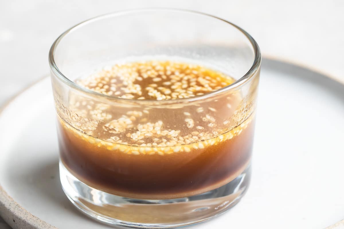 Sesame dressing in a clear dish.
