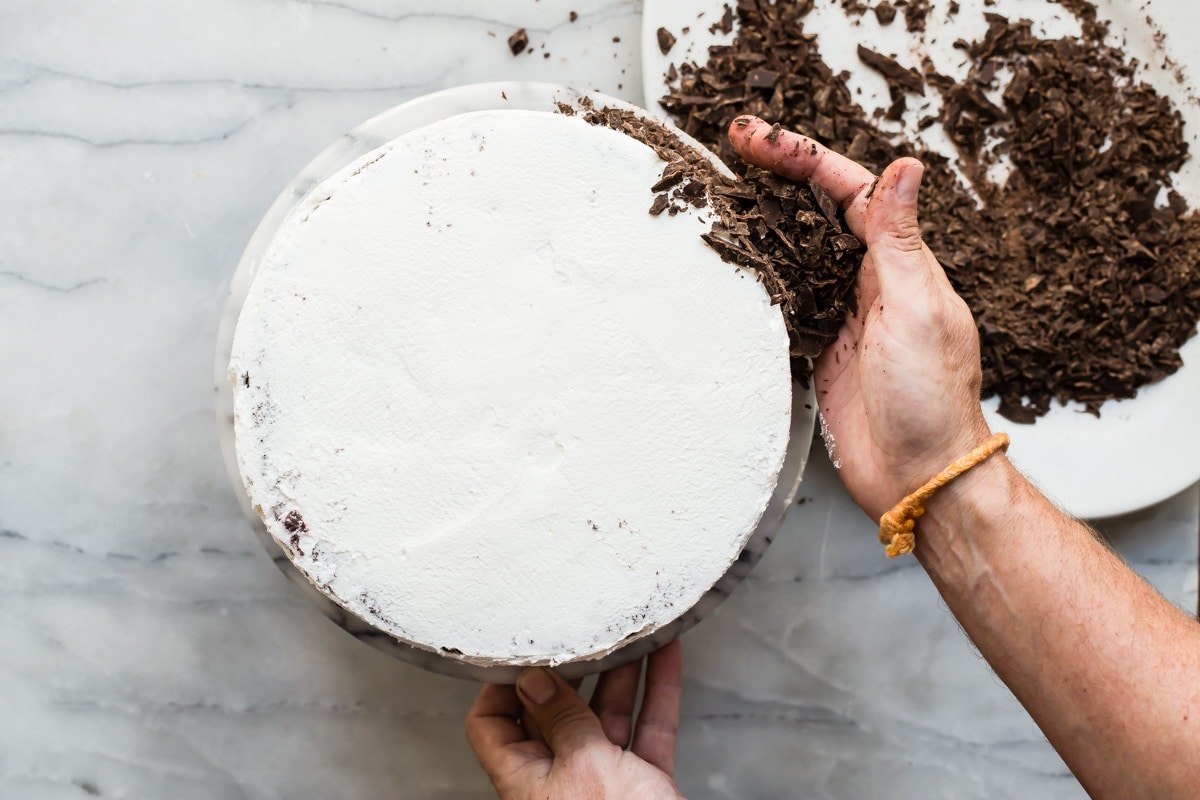 A frosted Black Forest Cake on a platter.