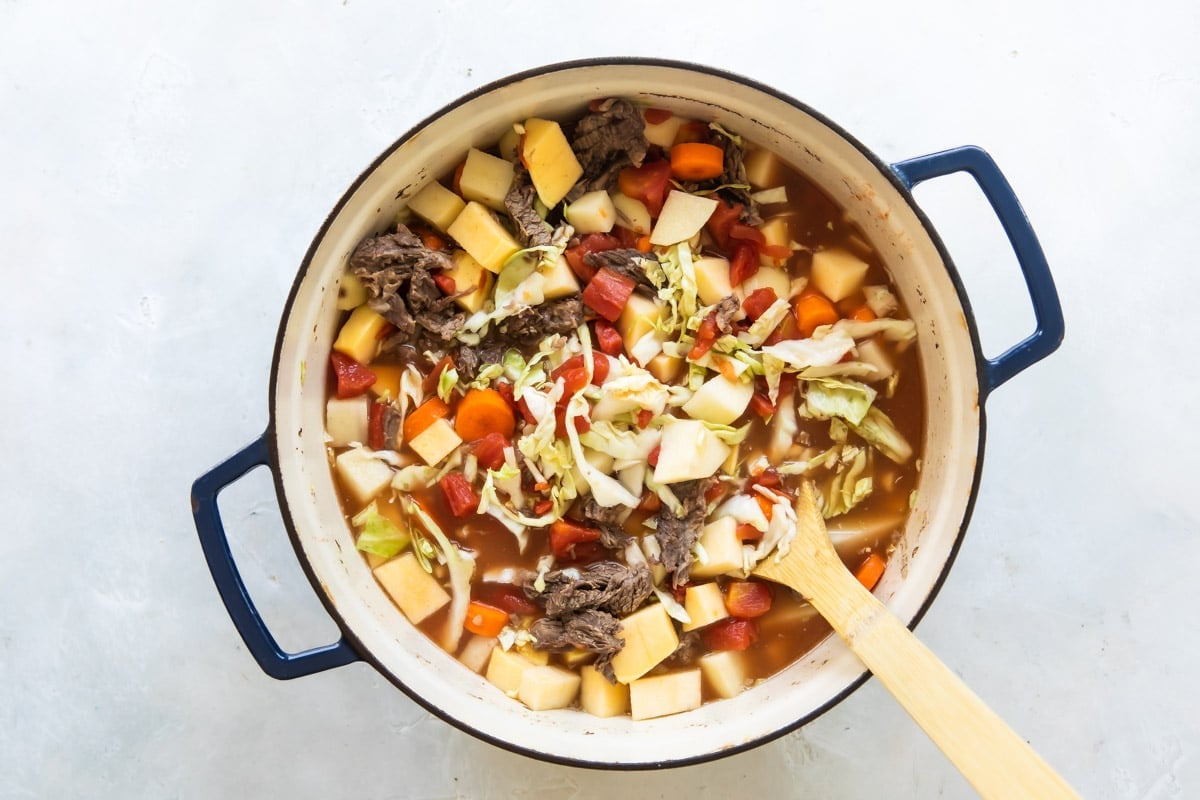 Booyah stew in a Dutch oven before being cooked.