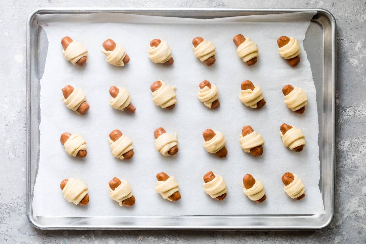 Easy pigs in a blanket on a baking sheet.