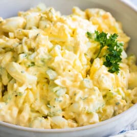 Egg salad in a white serving bowl.