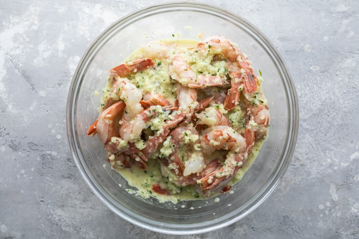 Shrimp marinating in garlic and herbs.