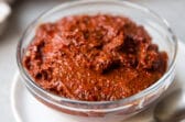 Harissa in a clear bowl.