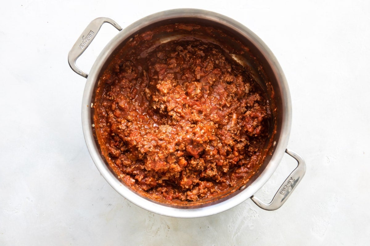 Meat sauce in a silver pot.