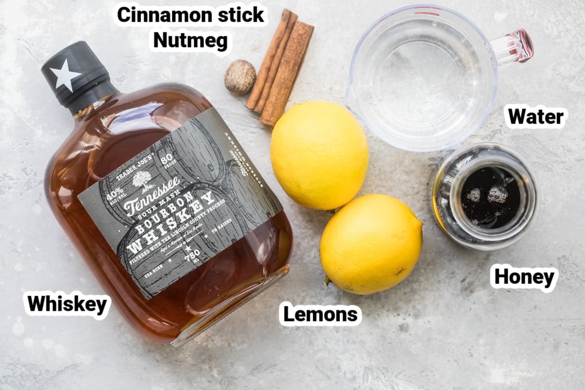 Labeled hot toddy ingredients on a countertop.