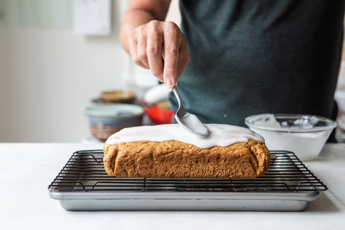 Glazing a Lemon Olive Oil Cake.