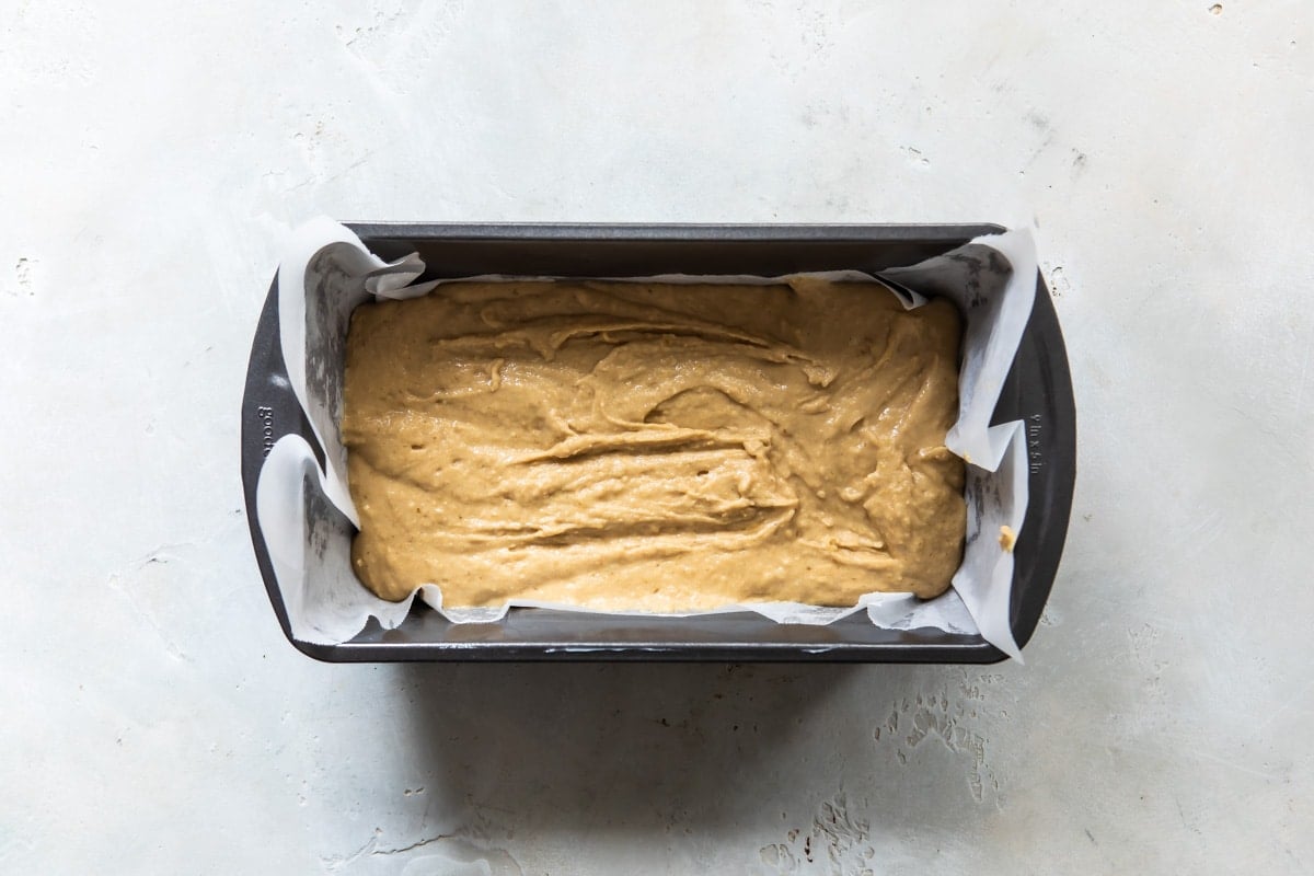 Lemon olive oil cake in a pan before being baked.