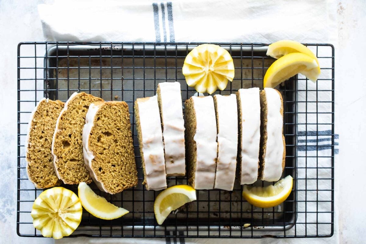 Slices of lemon olive oil cake on a cooling rack.