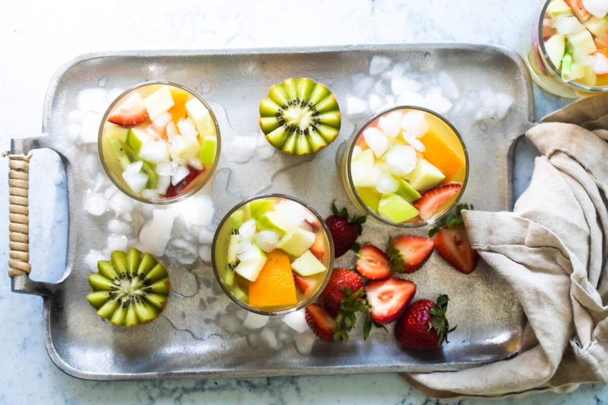 Moscato sangria in glasses on a serving tray.