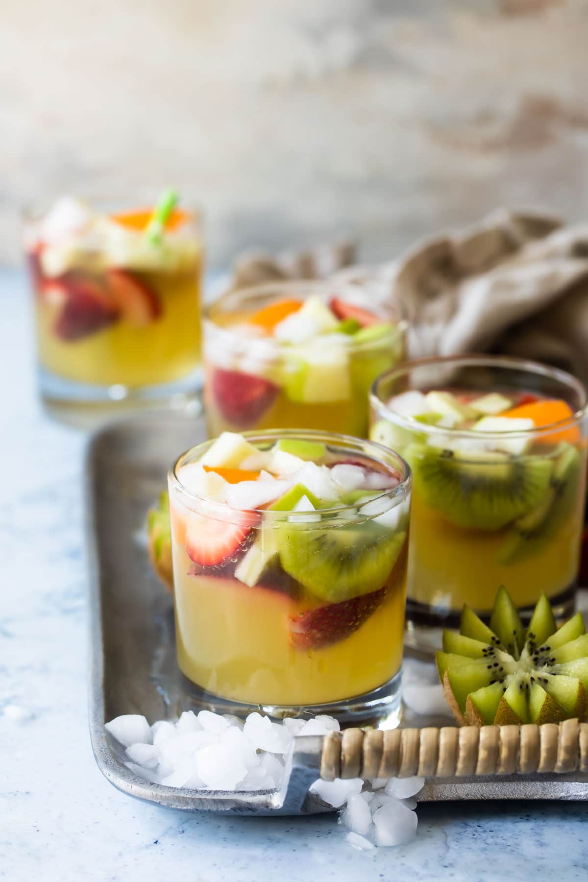 Moscato sangria in glasses on a serving tray.