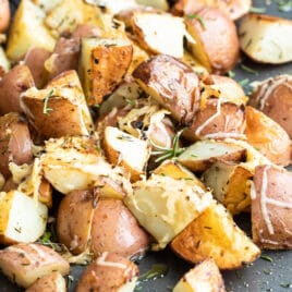 Roasted rosemary potatoes on a baking sheet.