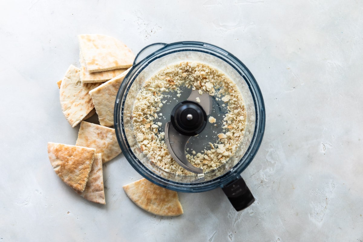 Pita bread crumbs in a food processor.