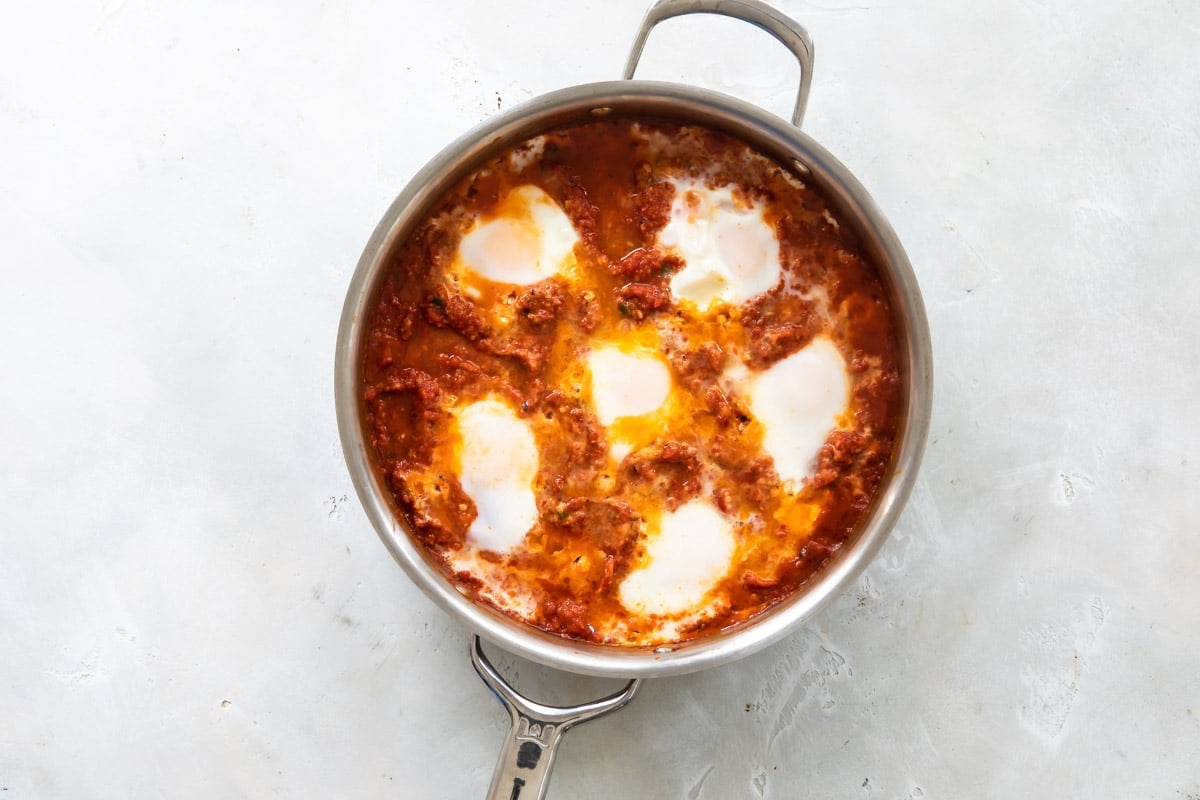Shakshouka in a silver skillet.