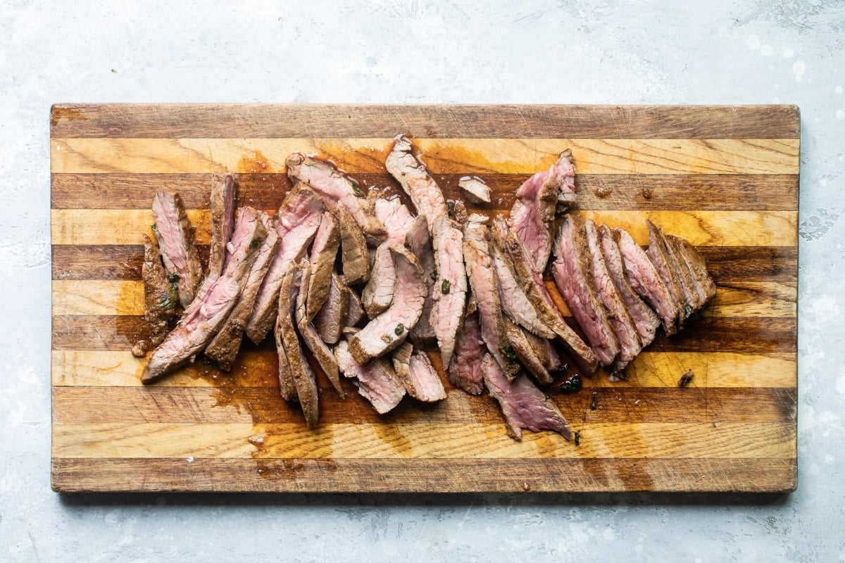 Steak being marinated in a Ziploc bag.